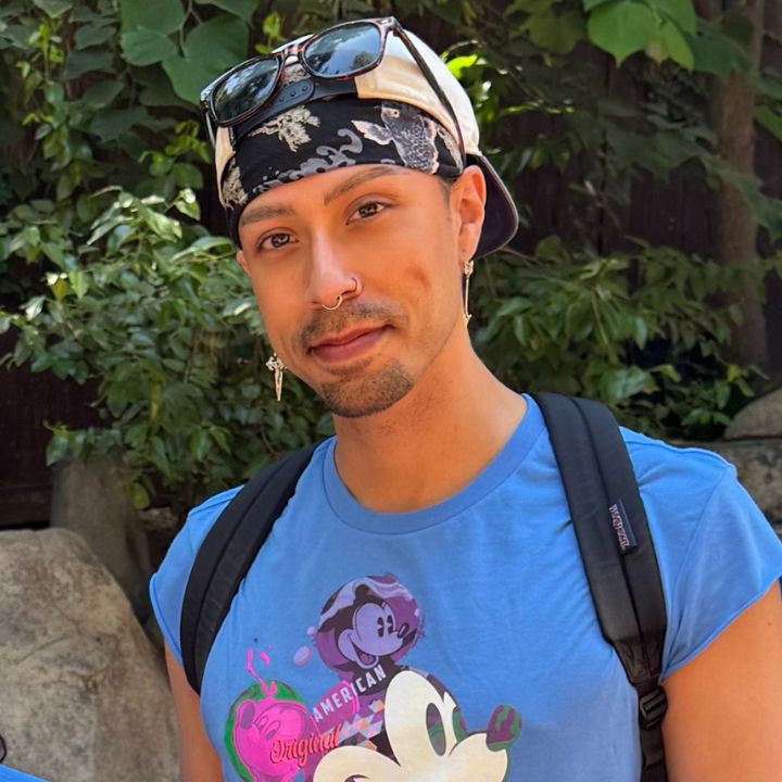 Photo of Josh La Cour in a blue Mickey Mouse shirt.